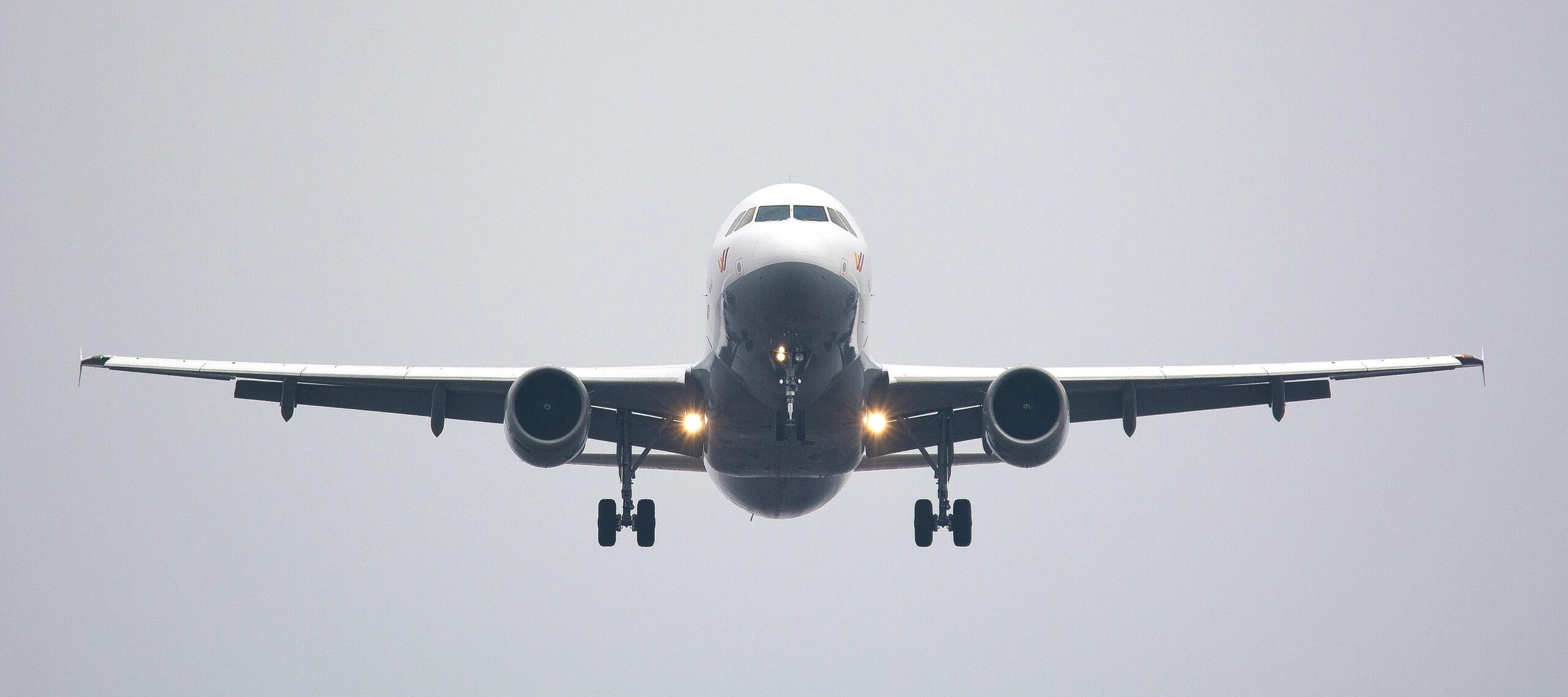 Photography of white Commercial Airplane.