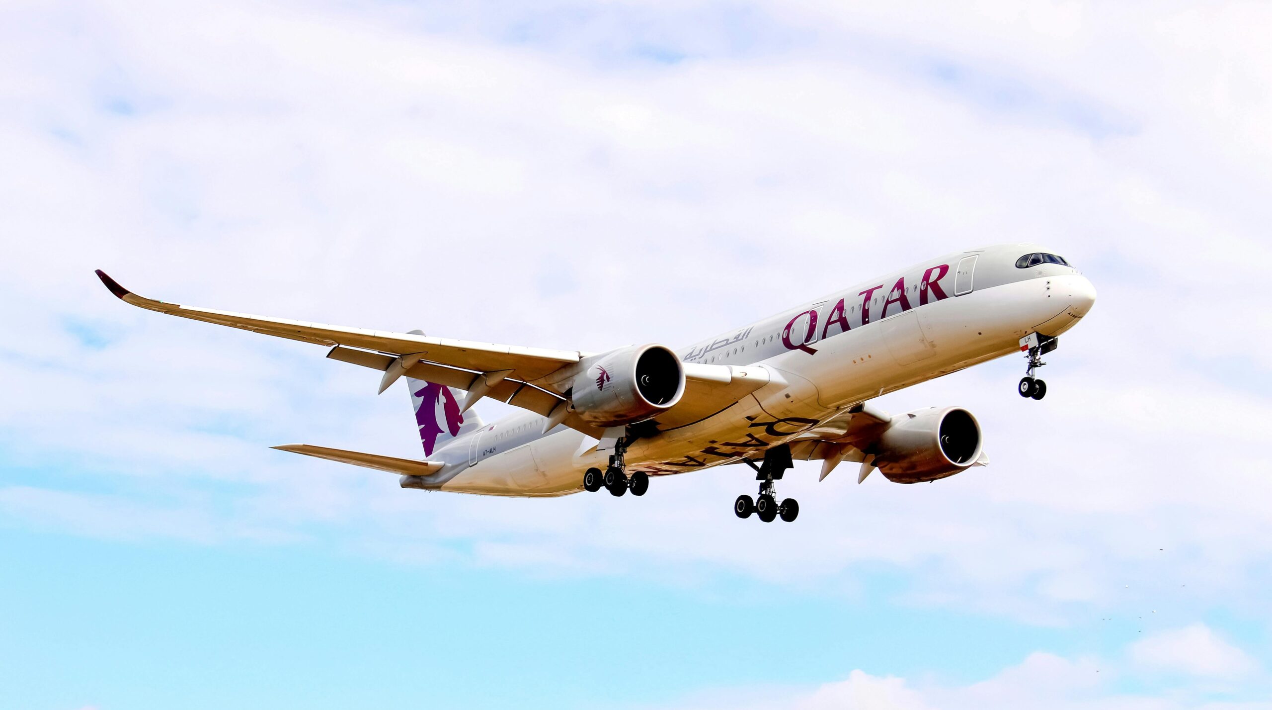 An Airborne plane with wheels down.