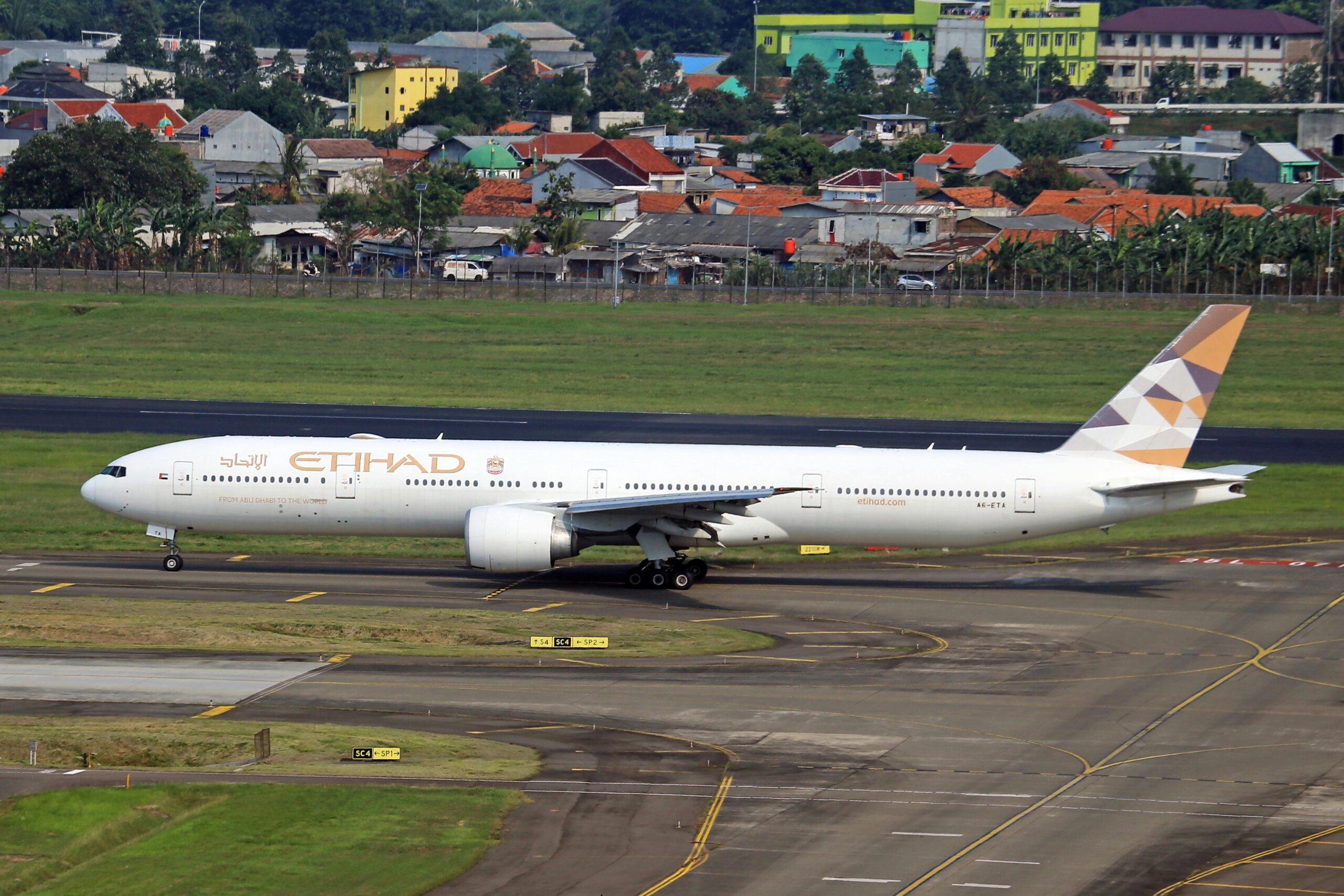 Etihad plane on the runway.