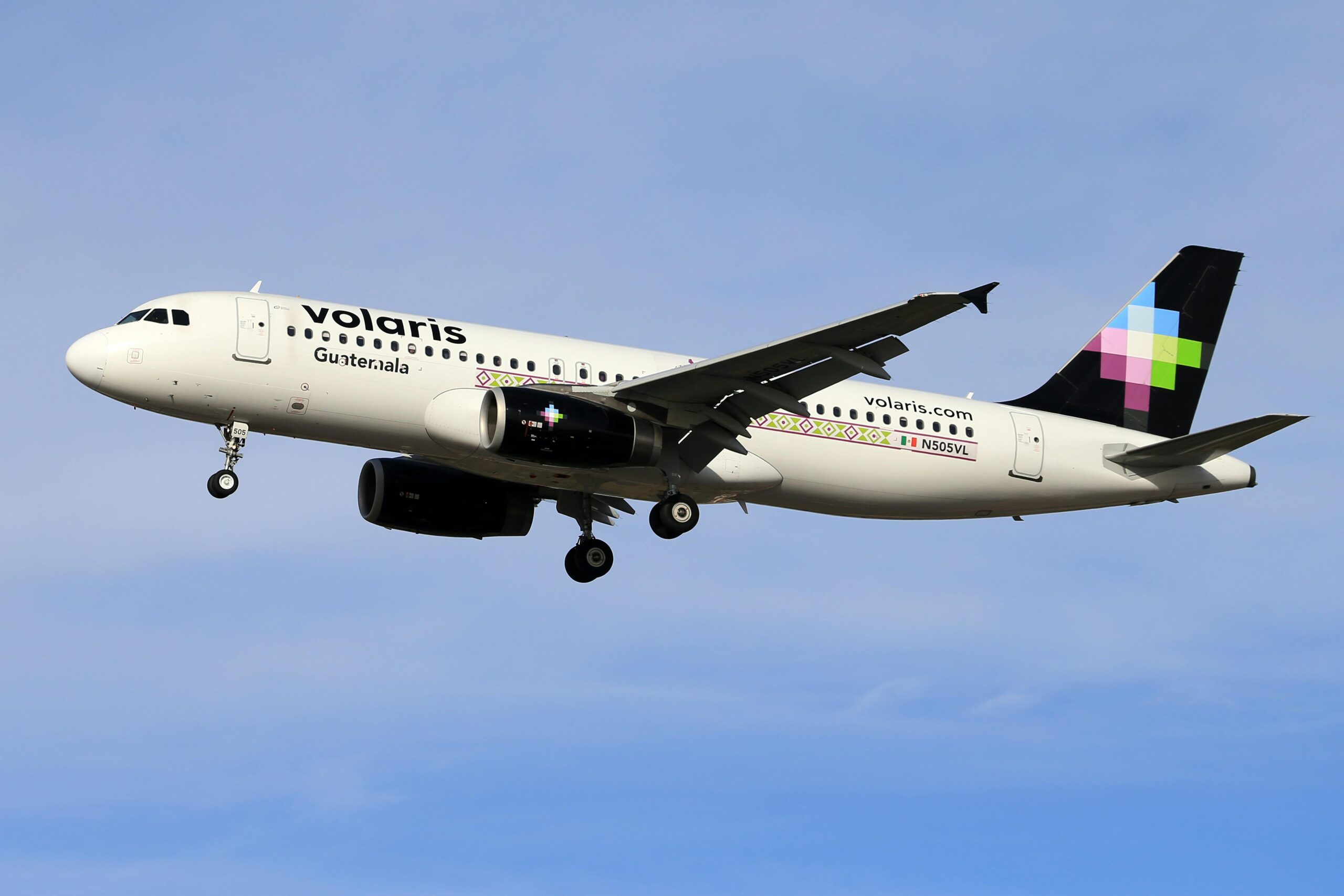 Volaris plane in the sky.