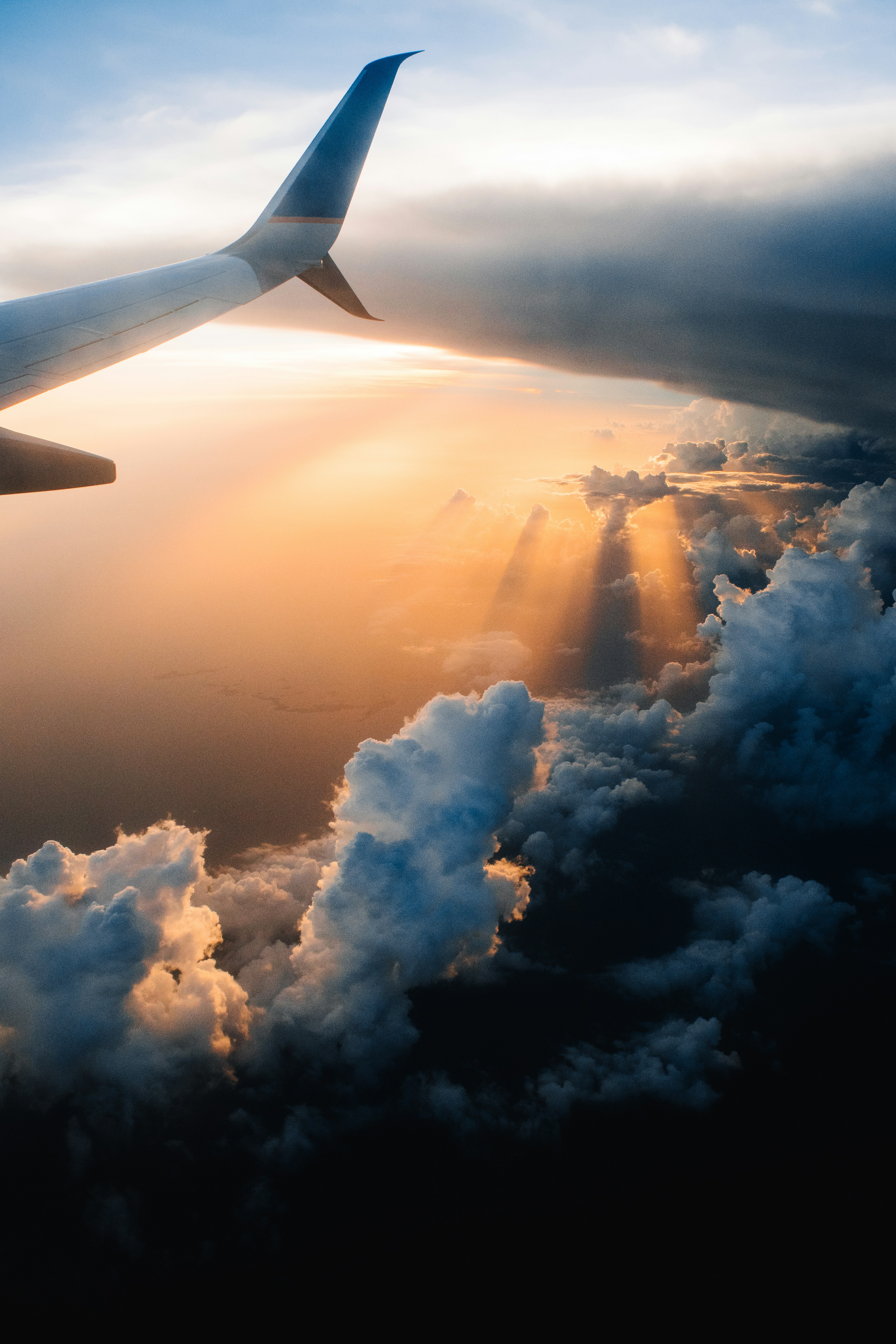 Airplane in the sky during golden hour.