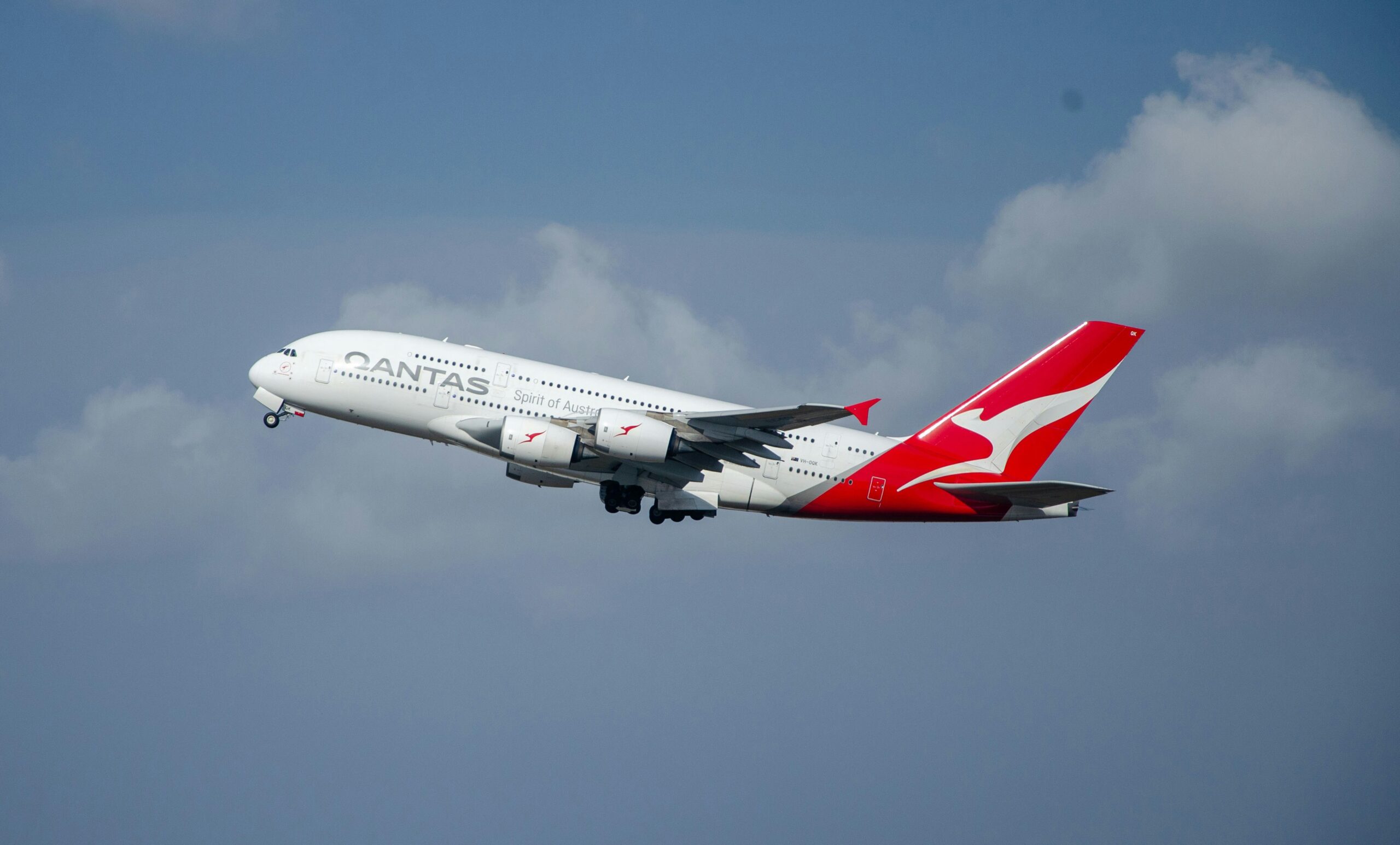 Qantas airplane flying in the sky.